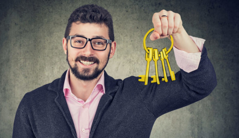 happy man holding old keys