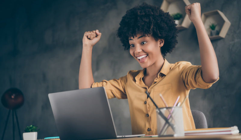 Low below angle view photo of cheerful excited executive having read reports of her workers ecstatic about results of annual preparation for corporate competitions